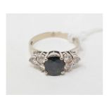 A 14ct white gold, blue stone and diamond ring, approx. ring size L Approx. 3.3 g (all in)