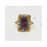 An amethyst and turquoise ring, in a yellow coloured metal mount, approx. ring size L