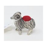 A novelty silver pincushion, in the form of a ram, 3.5 cm high Report by NG Modern