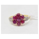 An 18ct gold, platinum, ruby and diamond ring, with central ruby flowerhead, approx. ring size T