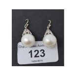 A pair of large cultured pearl and diamond drop earrings Believed 18ct gold