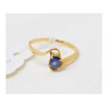 An 18ct gold and oval sapphire ring, approx. ring size L