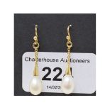 A pair of cultured pearl drop earrings Believed to be 18ct gold