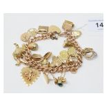A 9ct gold bracelet, with assorted 9ct and other charms, including an opening dog kennel with dog,