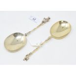 A pair of Edwardian silver gilt spoons, in the Dutch style, with figural terminals, Daniel & John