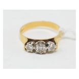 An 18ct gold and three stone diamond ring, approx. ring size Q½ Approx. 4.1 g (all in) Report by
