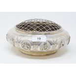 A Malaysian silver coloured metal posy bowl and mesh cover, the sides embossed with the twelve