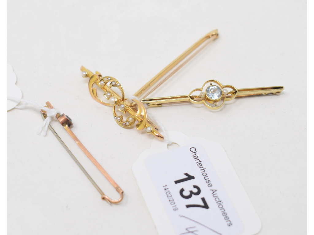 A 15ct gold and seed pearl bar brooch, and three other bar brooches (4)
