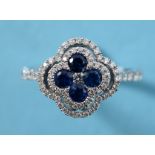 An 18ct white gold, sapphire and diamond cluster ring, in the form of a clover, approx. ring size K½