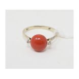 An 18ct white gold, coral and diamond ring, approx. ring size O Approx. 2.5 g (all in)