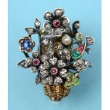 A white and yellow coloured metal brooch, in the form of a basket of flowers, set diamonds,