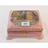 A pink porcelain box and cover, the cover decorated a courting scene, 20 cm wide