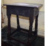 A carved oak joint stool, 17th century and later, 48 cm wide