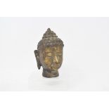 A bronze Buddha head, 13 cm high