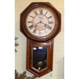 An Ansonia Clock Co drop dial wall clock, the white dial signed Hando Brecon, in a walnut case, 80.5