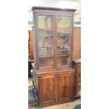 A 19th century mahogany bookcase on cupboard, 94 cm wide, a glazed cabinet, a dresser and a