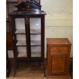 An oak bedside cupboard, with 17th century style inlaid decoration, 43 cm wide, and an Edwardian