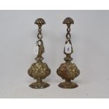 A pair of Indian silver coloured metal rosewater sprinklers, 23.5 cm high (2)