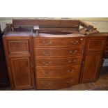 A Howard satinwood compactum (part), the serpentine section having five graduated long drawers,