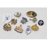 Nine sweetheart badges, including The Buffs, Cornwall LI and Norfolk