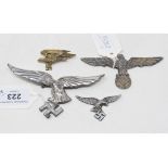 A Luftwaffe peak cap eagle badges, and Army peak cap eagles (one with loss) (4)