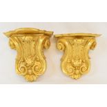 A pair of carved giltwood brackets, 16.5 cm wide