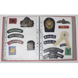Assorted WWII Divisional Signs, shoulder titles and other badges, including a WWI RFC wing Report by