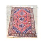 A Persian rug, 145 x 92 cm