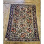 An Eastern rug, decorated stylised floral designs on an ivory ground, within a multi border, 170 x