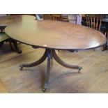 A mahogany oval dining table, on splayed legs, 177 cm wide