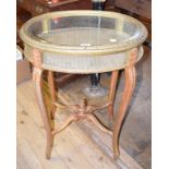 A giltwood vitrine, on cabriole legs joined by a shaped X stretcher, 61 cm wide One piece of glass