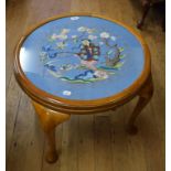 A coffee table, decorated an Eastern embroidery, 60 cm diameter and another (2)