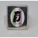 A silver cigarette case, later applied a cat plaque, 8 cm wide