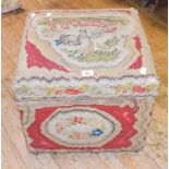 A woolwork ottoman, 49 cm wide, and three woolwork cushions (4)