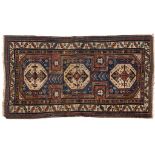 An Eastern rug, decorated geometric motifs on a light blue ground, within a multi border, 204 x