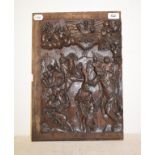 An oak panel, carved a religious scene, 42.5 x 30 cm