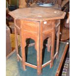 An Indian brass inlaid octagonal table, on a folding stand, 51 cm wide report by RB Lacks a side