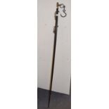 An Eastern ebonised measuring stick, 154 cm high