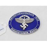 A Nazi National Socialist Flyer Corp (NSFK) enamel badge, marked ROB NEFF, Berlin WS7