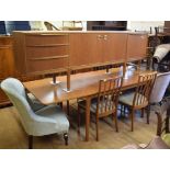 A McIntosh & Co teak dining suite, comprising a sideboard, an extending dining table and six