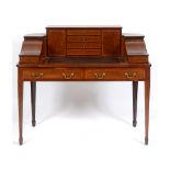 An Edwardian mahogany Carlton House style desk, crossbanded in satinwood and with boxwood and