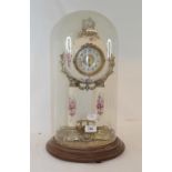 A portico style clock, under a glass dome, on a wooden base, 49 cm high