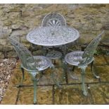 A metal garden table, 72 cm diameter and three matching chairs (4)