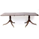 A Regency style mahogany twin pillar dining table, inset an extra leaf, 212 cm wide See illustration