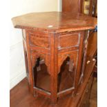 A Moorish style octagonal table, with brass inlay, 67 cm wide Report by GH Most of the side panels