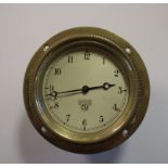 A Smiths swing out dashboard clock, with silvered Arabic numeral dial, as fitted to vintage