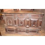 An oak mule chest, the lift up top above panels with geometric mouldings, and a drawer below, 134 cm