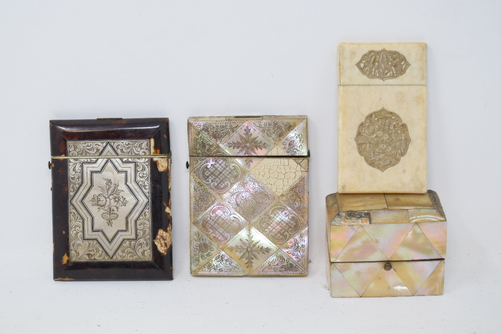 A tortoiseshell and mother of pearl card case, 10.5 cm high, another mother of pearl card case, a