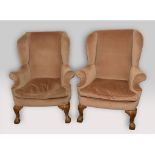 A pair of wingback armchairs, on cabriole legs with claw and ball feet See illustration Report by GH