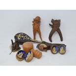 Three pairs of novelty treen nut crackers, a 19th century novelty inkwell, in the form of a